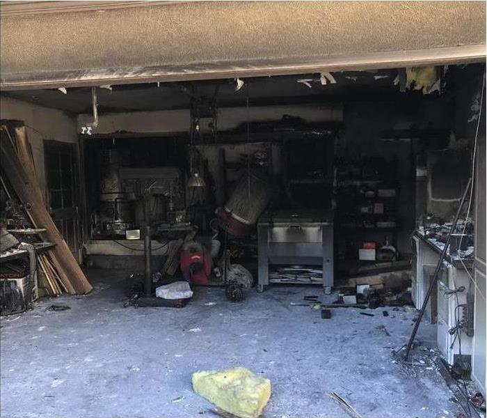 Home garage burned, content covered with soot