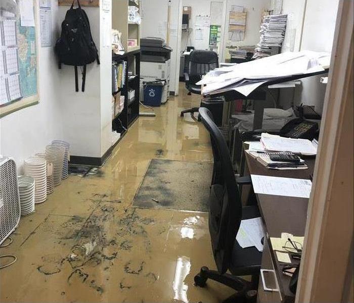 Flooded office, office floor with mud.