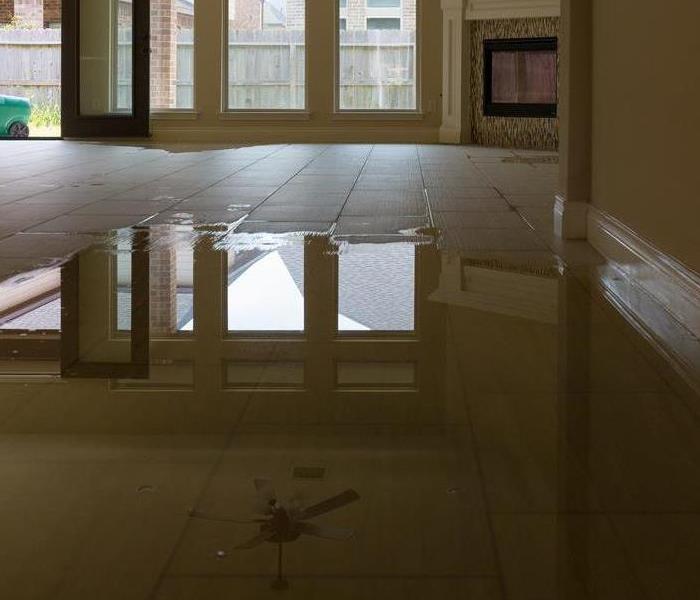 Pool of water on floor.